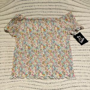 The brand of this shirt is art class, juniors size L. Very stretchy